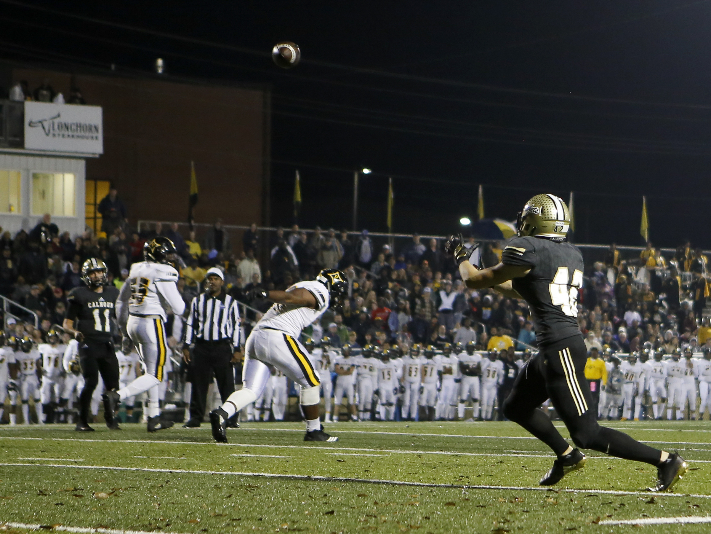 Calhoun's David Braden (42) catches a pass from Gavin Gray (11) against Peach County during the GHSA Class AAA semifinals at Phil Reeve Stadium on Friday, Nov. 30, 2018 in Calhoun, Ga.