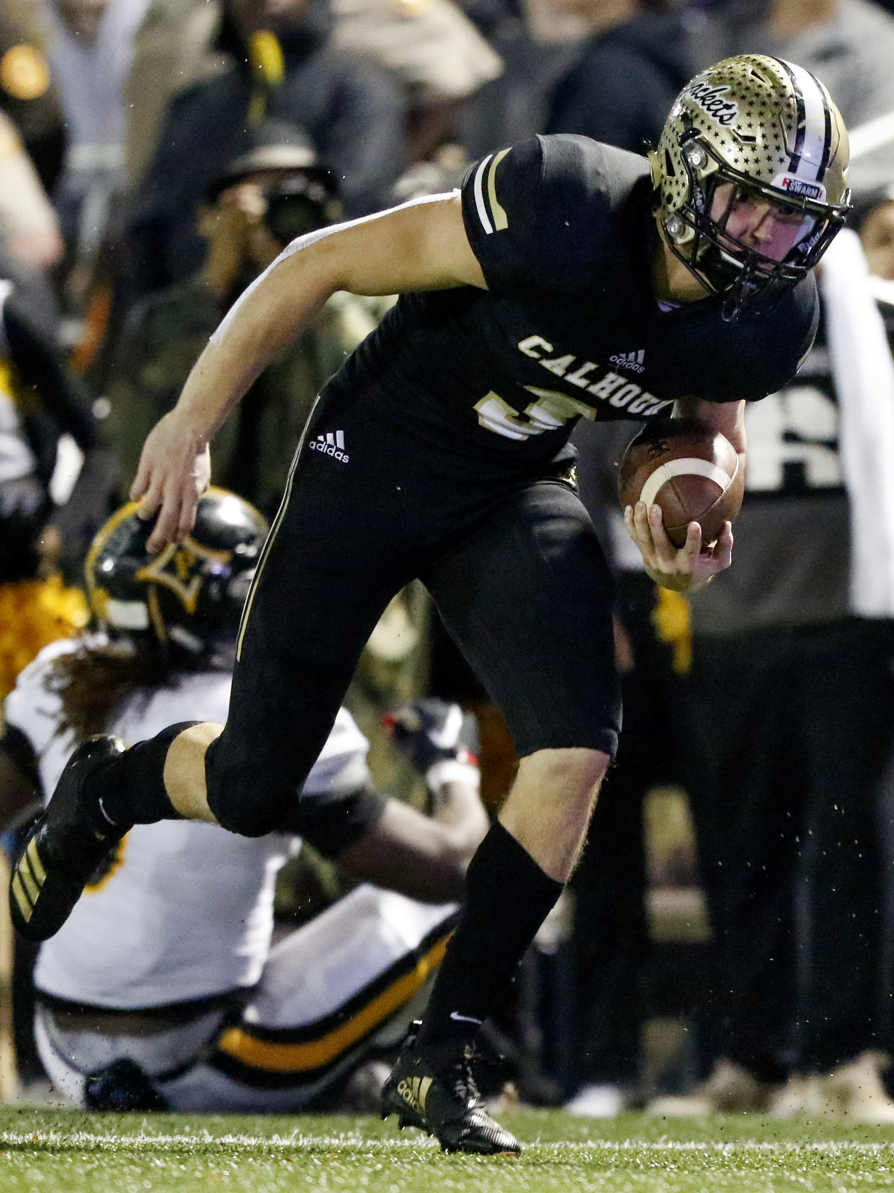 Calhoun's Brannon Spector (3) returns an interception against Peach County during the GHSA Class AAA semifinals at Phil Reeve Stadium on Friday, Nov. 30, 2018 in Calhoun, Ga. Spector's interception would stand but the return was called back because of a penalty.