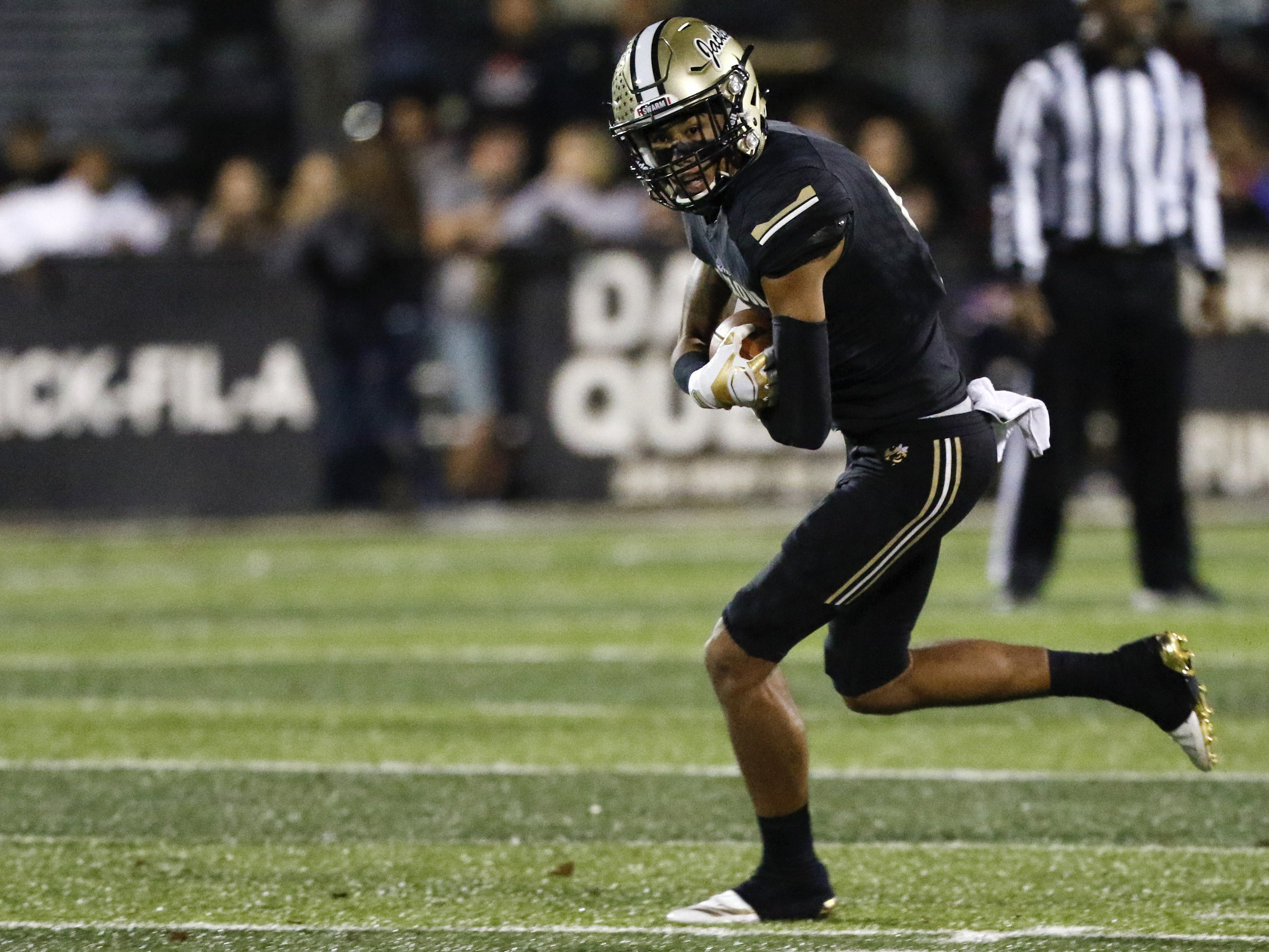 Calhoun's Luke Moseley (5) turns up field after making a catch against Peach County during the GHSA Class AAA semifinals at Phil Reeve Stadium on Friday, Nov. 30, 2018 in Calhoun, Ga.