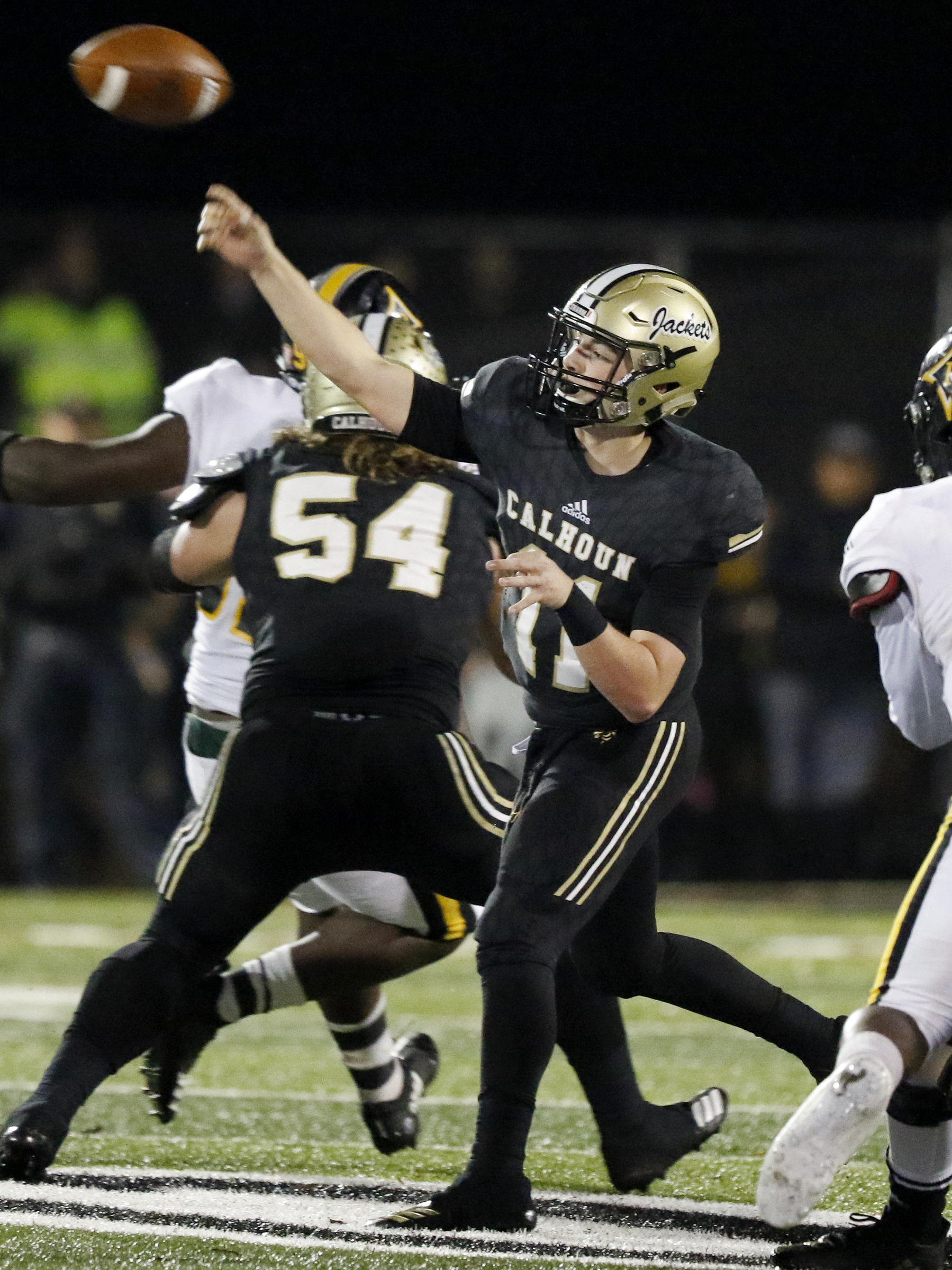 Calhoun's Gavin Gray (11) throws a pass against Peach County during the GHSA Class AAA semifinals at Phil Reeve Stadium on Friday, Nov. 30, 2018 in Calhoun, Ga.