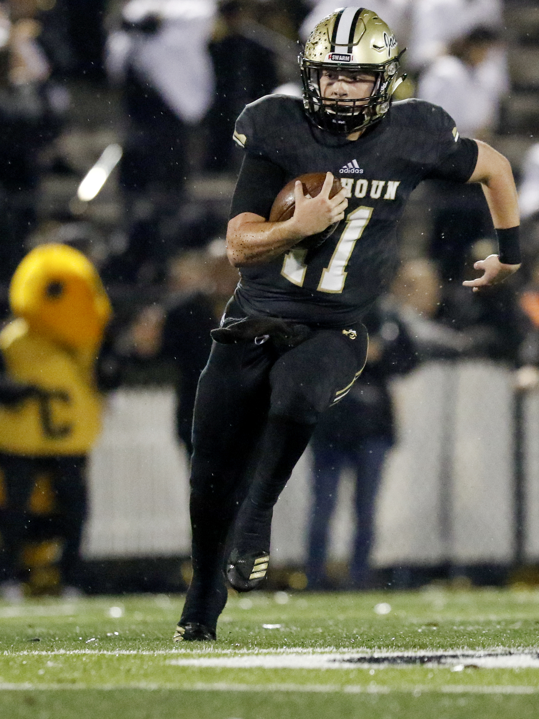 Calhoun's Gavin Gray (11) scrambles against Peach County during the GHSA Class AAA semifinals at Phil Reeve Stadium on Friday, Nov. 30, 2018 in Calhoun, Ga.