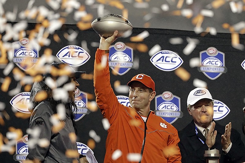 Clemson football coach Dabo Swinney celebrates after the Tigers beat Pittsburgh 42-10 in the ACC title game Saturday night in Charlotte, N.C.