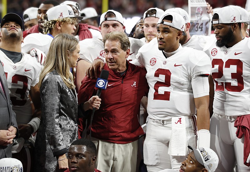 Alabama football coach Nick Saban and quarterback Jalen Hurts (2) are interviewed after the Crimson Tide's 35-28 victory over Georgia in Saturday's Southeastern Conference championship game in Atlanta.
