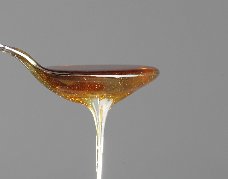 A spoonful of Dark Wildflower Honey from Strange Honey Farms is shown at the Times Free Press studio in 2012.