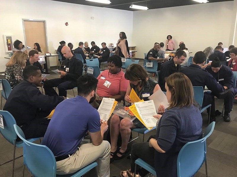 Cadets partner with community members, professionals and students to participate in the Community Action Poverty Simulation. Participants were assigned roles at random, and either found themselves in a family unit or as an individual living on their own in the community. (Contributed photo)