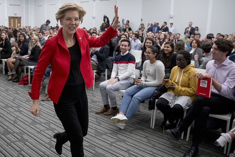 Sen. Elizabeth Warren, D-Massachusetts, waves as she departs after speaking at the American University Washington College of Law in Washington last Thursday. (AP Photo/Andrew Harnik)