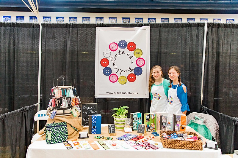 Young entrepreneurs Mary Claire Nimon, left, and Abbey Katelyn Pettus man their booth at GPS' annual MBD Marketplace, which welcomes girls ages 7-17 to sell their unique products and services. Thanks to sponsorships, there are no booth fees and all the essentials, such as table, chairs and drapes, are provided.