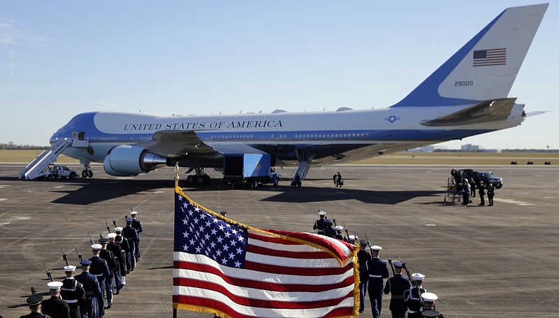 With the flag-draped casket of former President George H.W. Bush aboard at Ellington Field, Special Air Mission 41 prepares to depart, Monday, Dec. 3, 2018, in Houston. (AP Photo/Eric Gay)