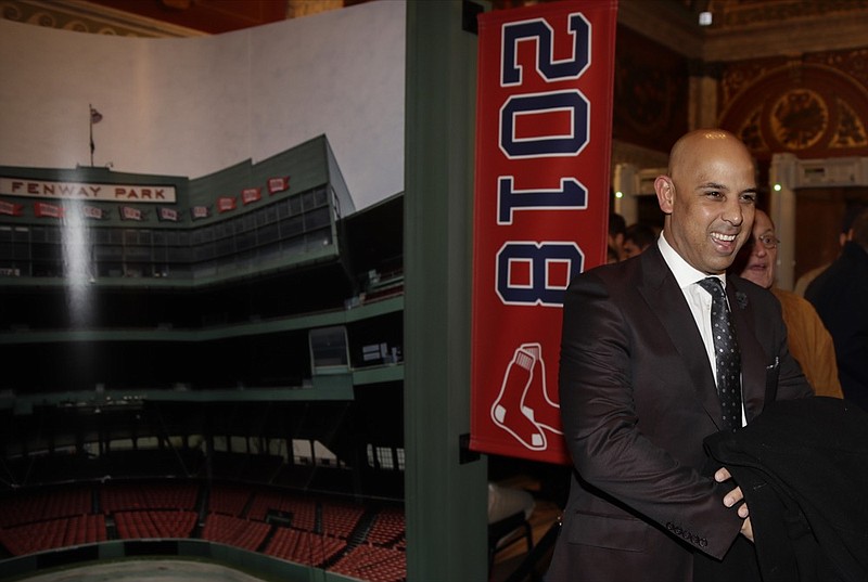 Boston Red Sox manager Alex Cora smiles as he walks the red carpet prior to the premiere of "The 2018 World Series: Damage Done," documentary production that captures video moments of the Red Sox's march towards the 2018 World Series Championship, Monday, Dec. 3, 2018. (AP Photo/Charles Krupa)

