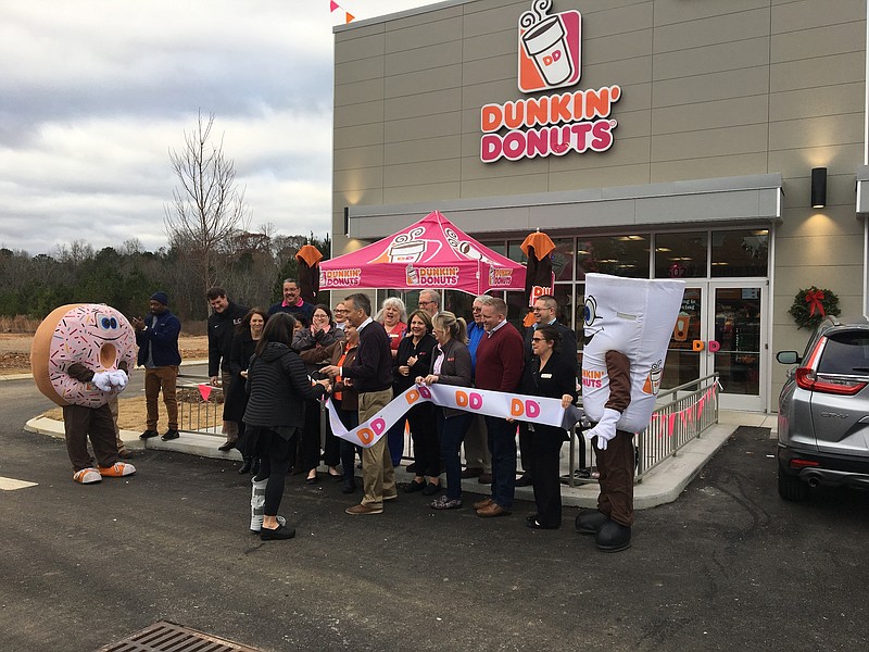 Dave Baumgartner, center with scissors, prepares to cut the ribbon to open his 38th Dunkin outlet in Ooltewah. / Photo by Dave Flessner
