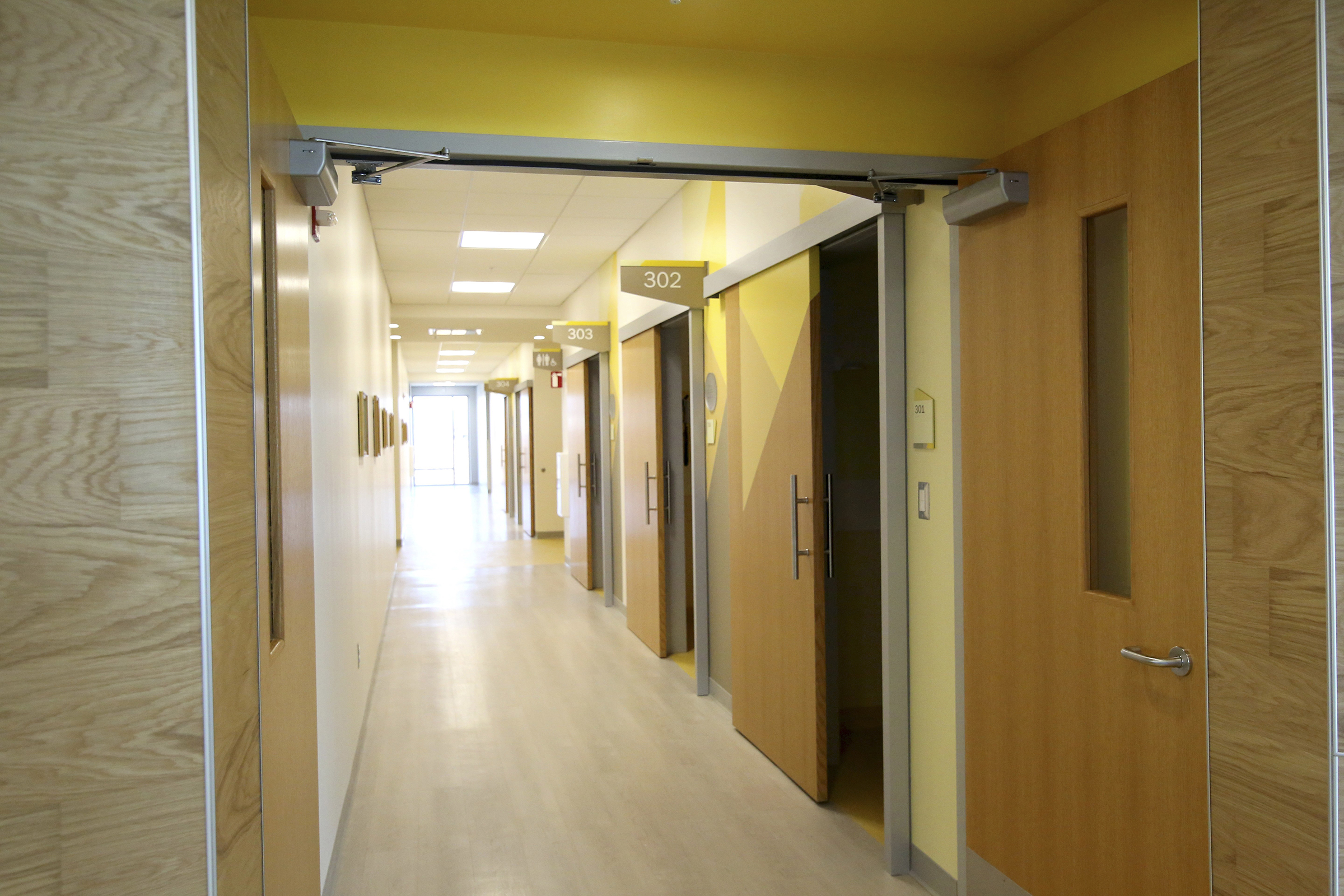 Staff photo by Erin O. Smith / One hallway with patient rooms is painted yellow at Erlanger's new children's outpatient center Wednesday, Nov. 28, 2018 in Chattanooga, Tennessee. Each hallway at the center is designated by color instead of by line of service to make the facility more kid-friendly.