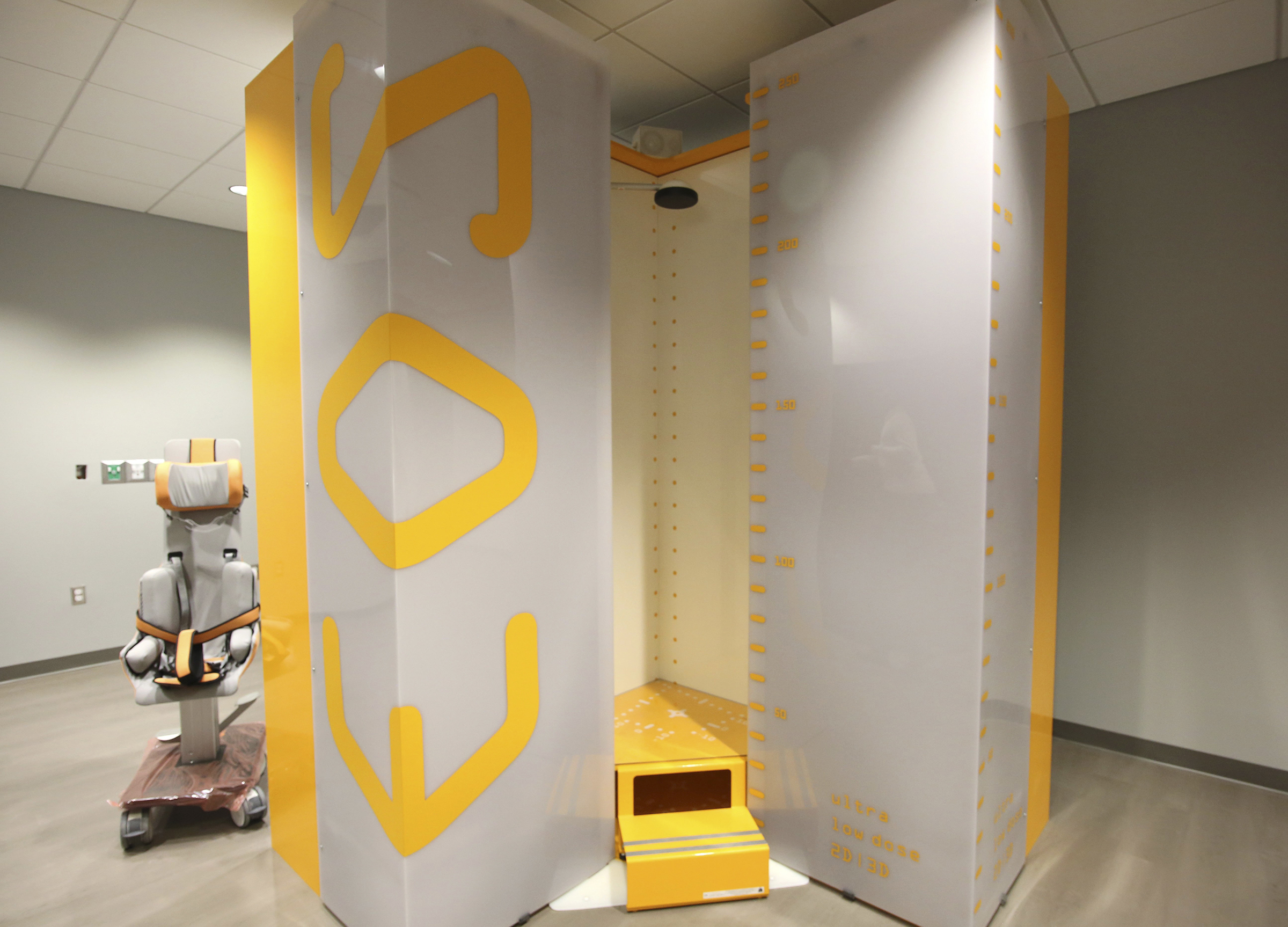 Staff photo by Erin O. Smith / A EOS standup X-ray machine sits in one of the rooms at Erlanger's new children's outpatient center Wednesday, Nov. 28, 2018 in Chattanooga, Tennessee. One of the uses of the machine is to better see the spine of scoliosis patients in the standing position, giving doctors the ability to see a patient's natural, weight-bearing posture.