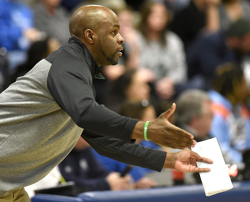 Notre Dame head coach Jonathan Adams instrucst his players from the sidelines.  The Boyd-Buchanan Buccaneers hosted the Notre Dame Fighting Irish in a rivalry boy's basketball on December 4, 2018. 