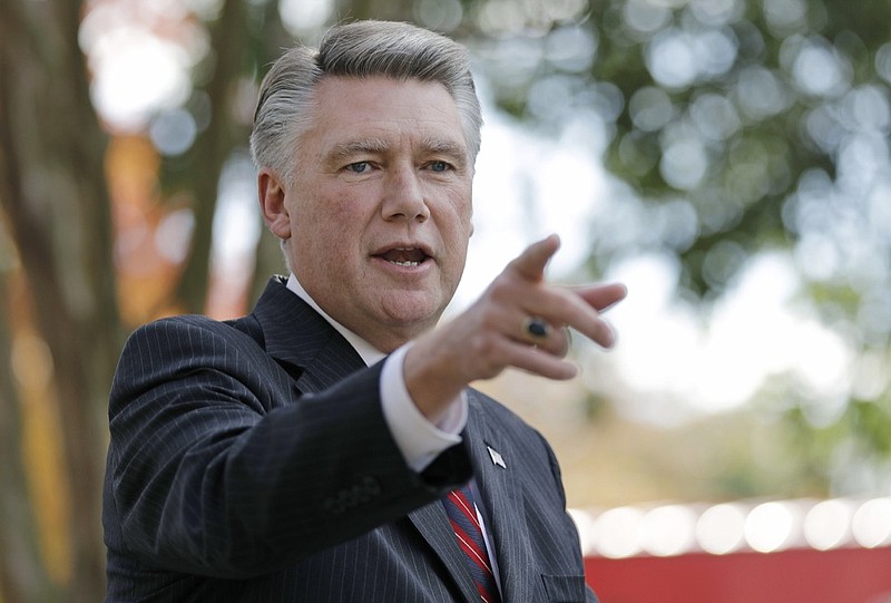 In this Nov. 7, 2018, file photo, Mark Harris speaks to the media during a news conference in Matthews, N.C. The nation's last unresolved fall congressional race with Harris against Democrat Dan McCready is awash in doubt as North Carolina election investigators concentrate on a rural county where absentee-ballot fraud allegations are so flagrant they've put the Election Day result into question. (AP Photo/Chuck Burton, File)