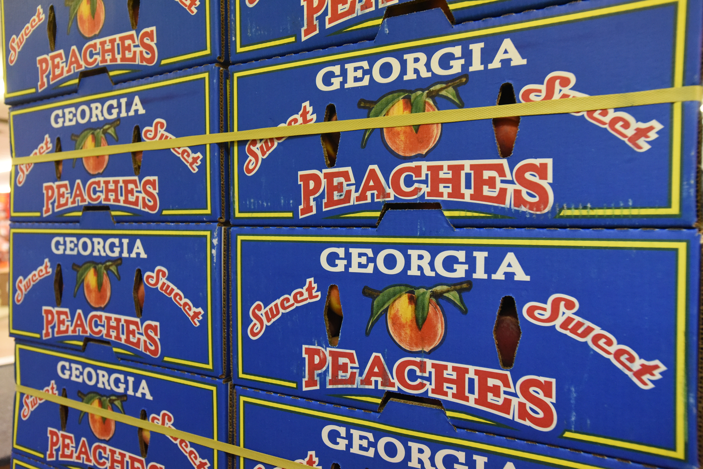Boxes of peaches sit on a palette at East Ridge Hardware Friday, July 8, 2016.