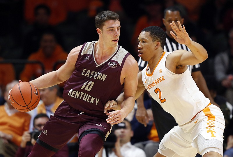 Eastern Kentucky forward Nick Mayo, left, works for a shot while guarded by Tennessee forward Grant Williams during their teams' Nov. 28 game in Knoxville. Tennessee won 95-67.