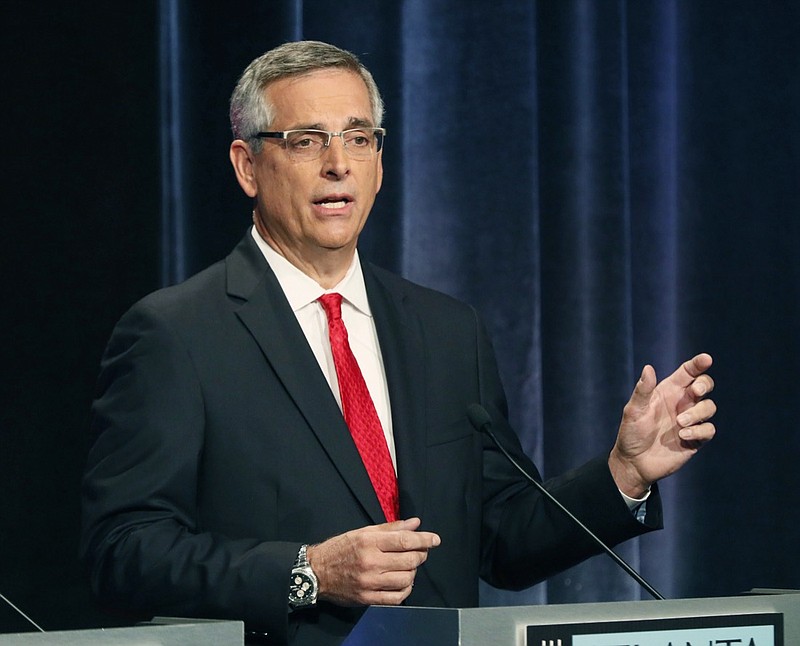 In this Oct. 2, 2018, file photo, Republican Brad Raffensperger participates in a debate in Atlanta. Raffensperger will take over as Georgia's secretary of state in January after winning a runoff Tuesday, Dec. 4. The race gained attention after GOP Gov.-elect Brian Kemp, who stepped down as secretary of state after the November election, was accused by Democrats of suppressing votes. (Bob Andres/Atlanta Journal-Constitution via AP, File)