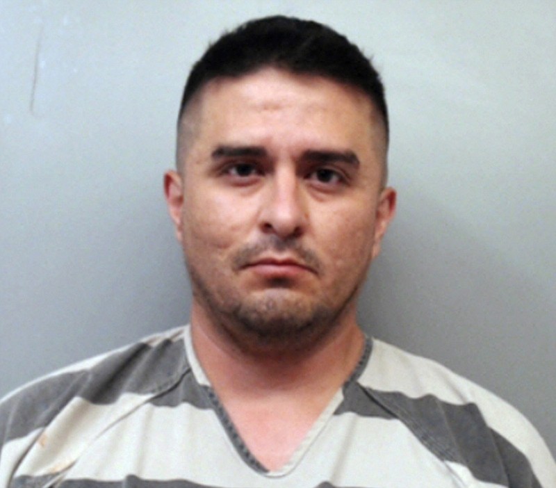 This file photo provided by the Webb County Sheriff's Office shows U.S. Border Patrol agent Juan David Ortiz. Ortiz, who confessed to shooting four women in the head and leaving their bodies on rural Texas roadsides, was indicted Wednesday, Dec. 5, 2018, on a capital murder charge. (Webb County Sheriff's Office via AP, File)