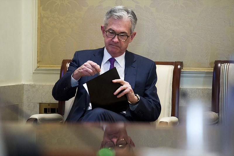 In this Thursday, Nov. 29, 2018, file photo Federal Reserve Chairman Jerome Powell waits to address the Federal Reserve Board's 15th annual College Fed Challenge Finals in Washington. The Federal Reserve says that the U.S. economy was growing in the fall, but there were concerns about higher tariffs from a widening trade war, rising interest rates and tight labor markets. In its latest report on economic conditions around the country, the Fed says most of its 12 regions saw moderate growth through late November. Dallas and Philadelphia says growth had slowed while St. Louis and Kansas City depicted growth as slight. (AP Photo/Cliff Owen, File)