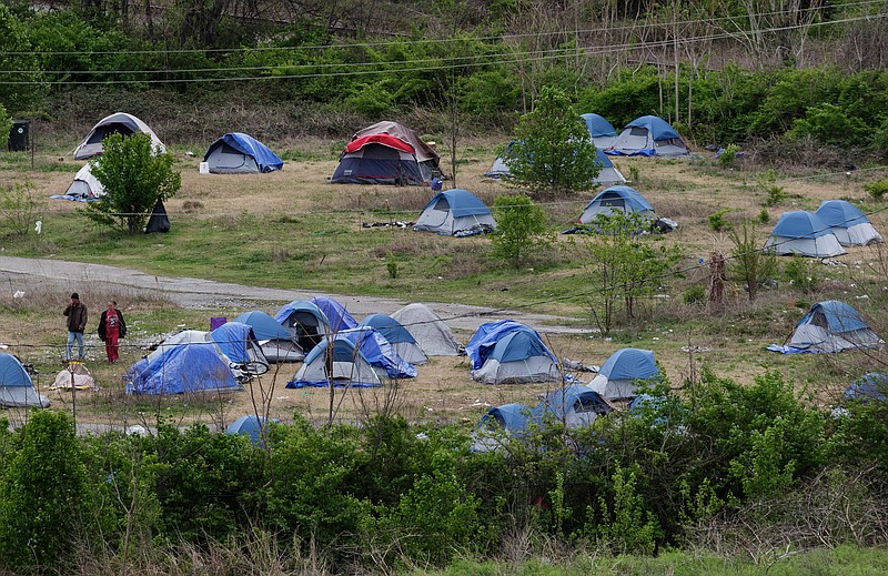 File photo by Doug Strickland / A homeless encampment off of East 11th Street last March was found to be on a toxic waste site and had to be removed. The city is now taking the lead to help rethink how we help the homeless.