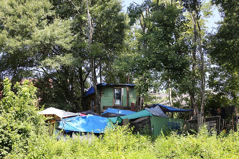 A homeless camp sits along Chattanooga Creek in August.