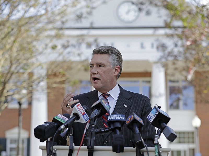 In this Nov. 7, 2018, file photo, Republican Mark Harris speaks to the media during a news conference in Matthews, N.C. North Carolina election officials agreed to hold a public hearing into alleged "numerous irregularities" and "concerted fraudulent activities" involving traditional mail-in absentee ballots in the 9th Congressional District. (AP Photo/Chuck Burton, File)