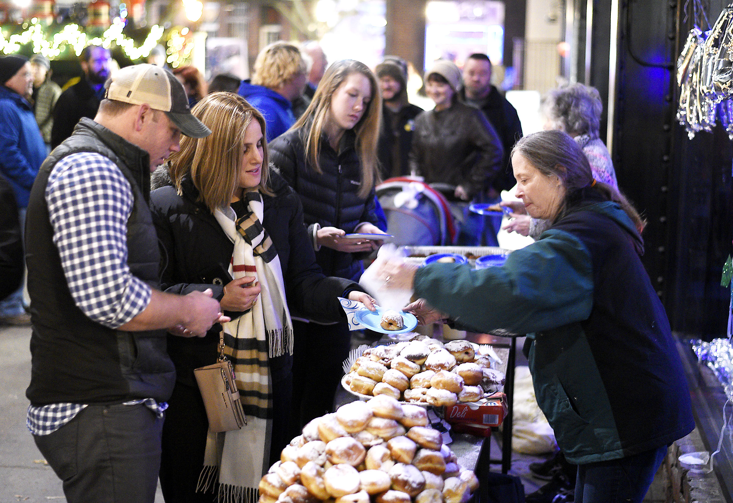 People are served Latkes, jelly donuts and other traditional items. Chabad of Chattanooga celebrated Hanukkah with A Menorah topped car parade to the Choo Choo and the lighting of the Menorah at Ice on the Landing on December 6, 2018.