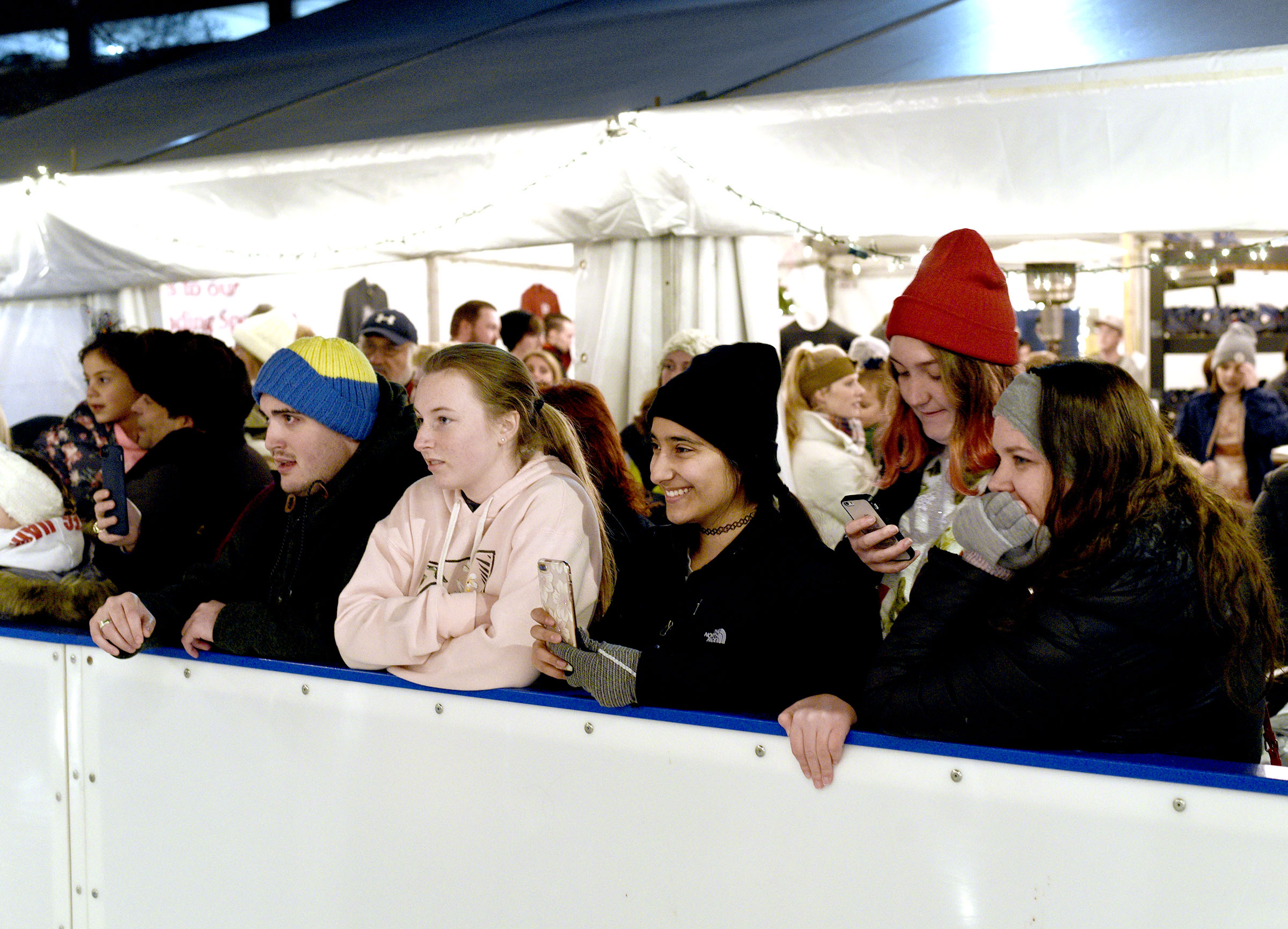 People watch from rink-side as the Menorah is lit. Chabad of Chattanooga celebrated Hanukkah with A Menorah topped car parade to the Choo Choo and the lighting of the Menorah at Ice on the Landing on December 6, 2018.