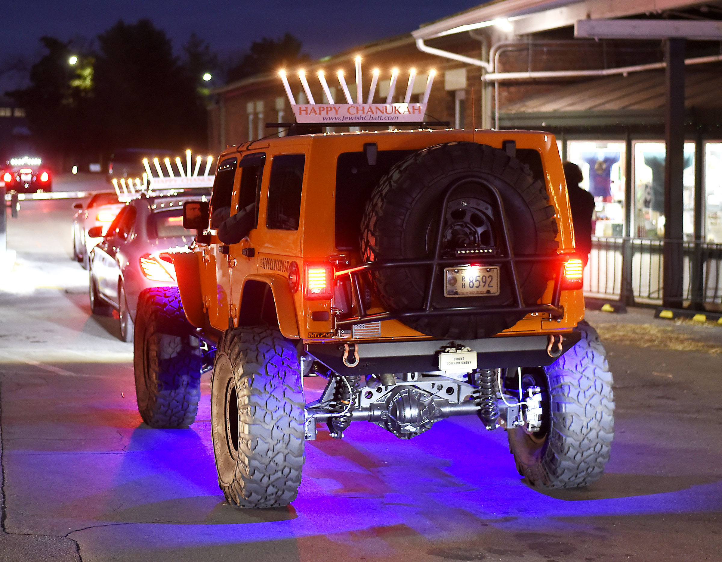 A off-road vehicle at the Choo Choo topped with a Menorah. Chabad of Chattanooga celebrated Hanukkah with A Menorah topped car parade to the Choo Choo and the lighting of the Menorah at Ice on the Landing on December 6, 2018.