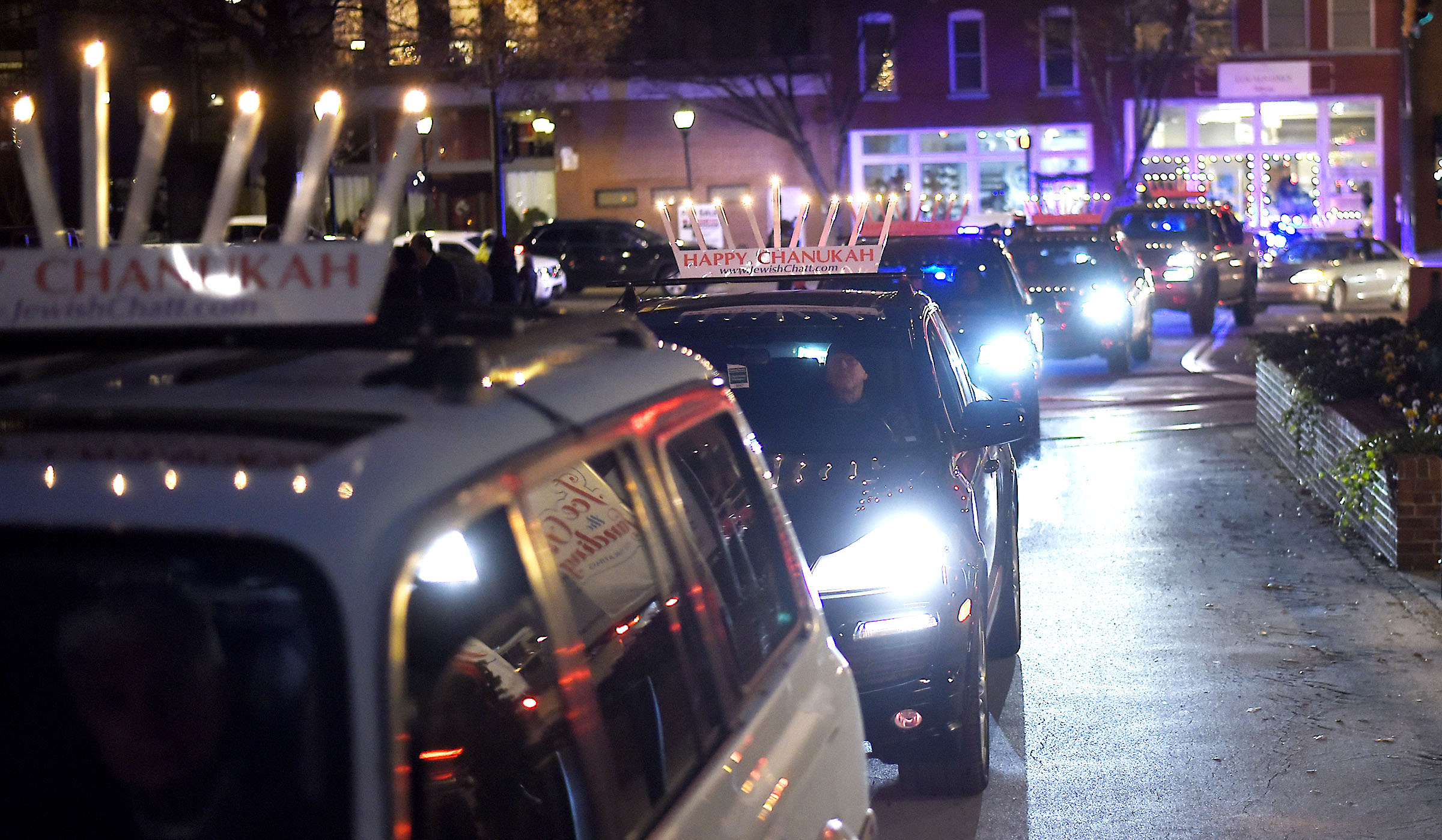Cars of the 25-vehicle Menorah-topped Hanukkah parade pull into the Choo Choo. Chabad of Chattanooga celebrated Hanukkah with A Menorah topped car parade to the Choo Choo and the lighting of the Menorah at Ice on the Landing on December 6, 2018.