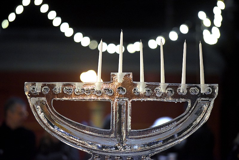 The Menorah topped with five candles since Thursday was the 5th day of the eight day festival waits to be lit.  Chabad  of Chattanooga celebrated Hanukkah with A Menorah topped car parade to the Choo Choo and the lighting of the Menorah at Ice on the Landing on December 6, 2018.