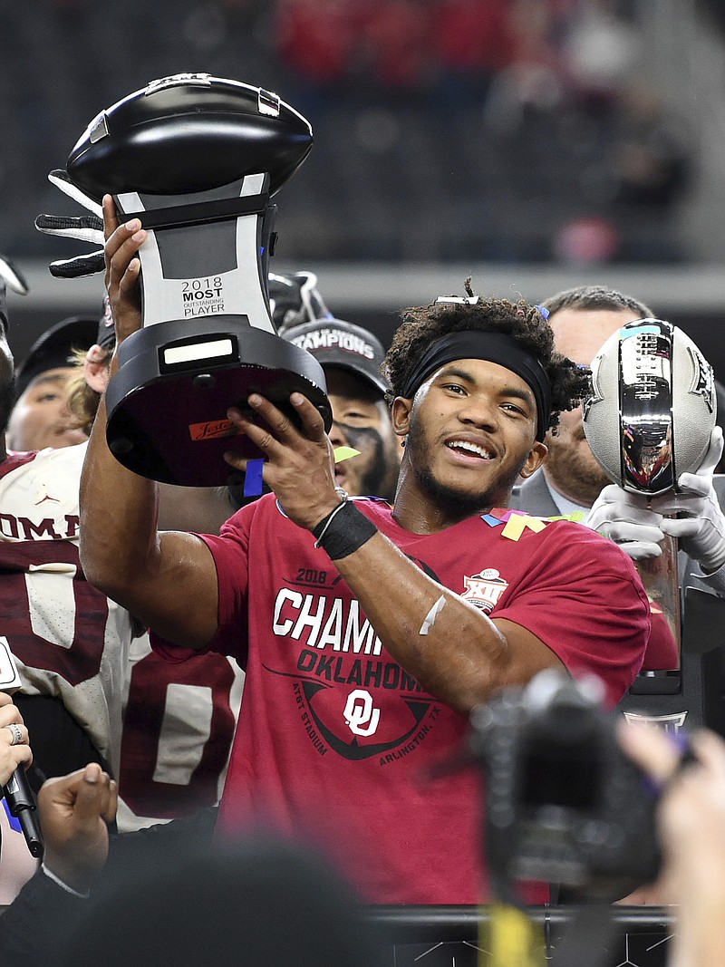 University of Oklahoma quarterback Kyler Murray hoists the most outstanding player trophy after leading the Sooners to a 39-27 victory over Texas in the Big 12 Conference title game last Saturday in Arlington, Texas. Murray was named The Associated Press college football player of the year on Thursday.

