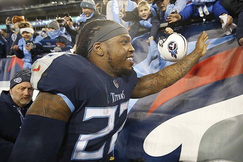 Tennessee Titans running back Derrick Henry accepts congratulations from fans after running for 238 yards and four touchdowns in Thursday night's 30-9 win against the Jacksonville Jaguars in Nashville.