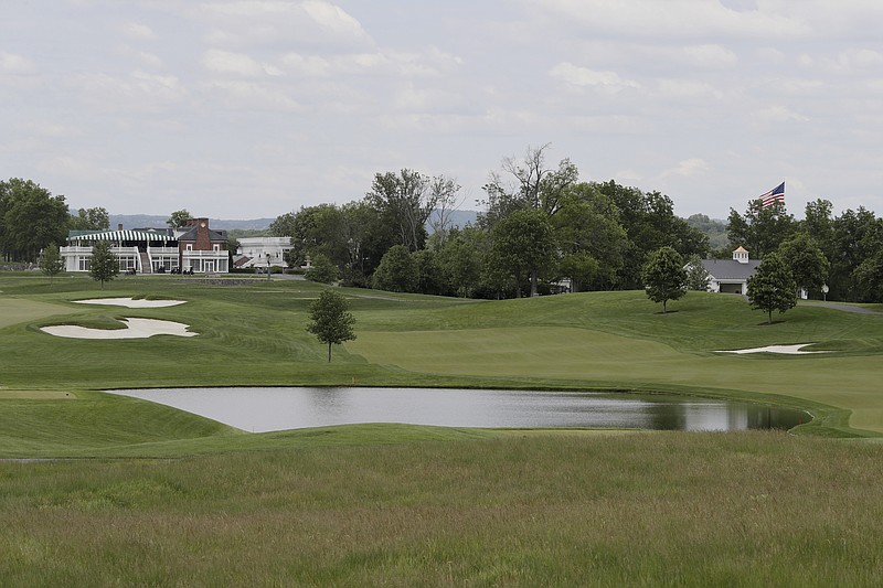 This May 24, 2017 file photo shows a view of Trump National Golf Club in Bedminster, N.J. Two women who cleaned rooms set aside for President Donald Trump at one of his golf resorts in New Jersey say they used false papers to get hired, their supervisors knew it and that many employees there also lack legal documents. The Trump Organization did not answer questions emailed by The Associated Press about the allegations, but said in a statement Thursday, Dec. 6, 2018, that it has the highest standards for job applicants. (AP Photo/Julio Cortez, File)