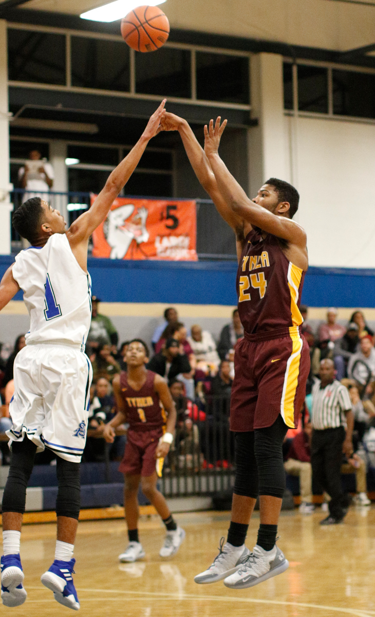 Tyner's Kobe Smith shoots over CSAS's Troy Pride during their prep basketball game at Chattanooga School for the Arts and Sciences on Friday, Dec. 7, 2018, in Chattanooga, Tenn.