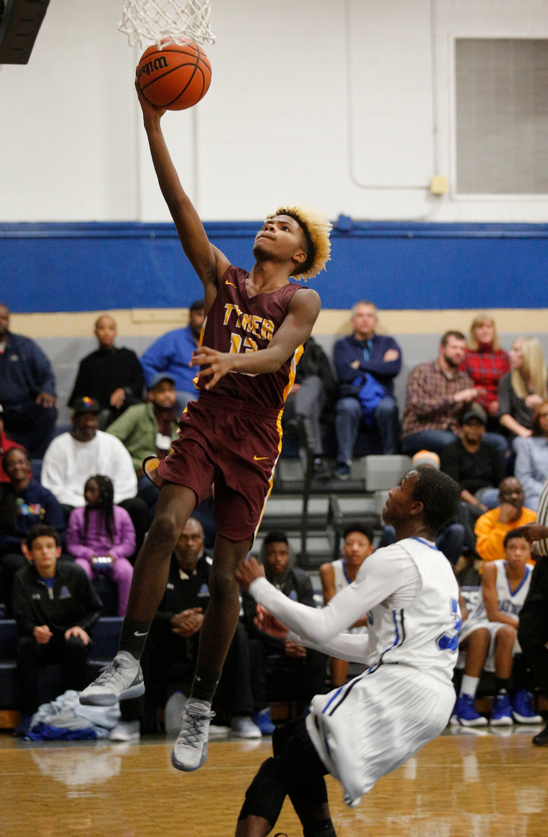 Tyner's Xavier Fisher shoots ahead of CSAS's Cahlib Edwards during their prep basketball game at Chattanooga School for the Arts and Sciences on Friday, Dec. 7, 2018, in Chattanooga, Tenn.