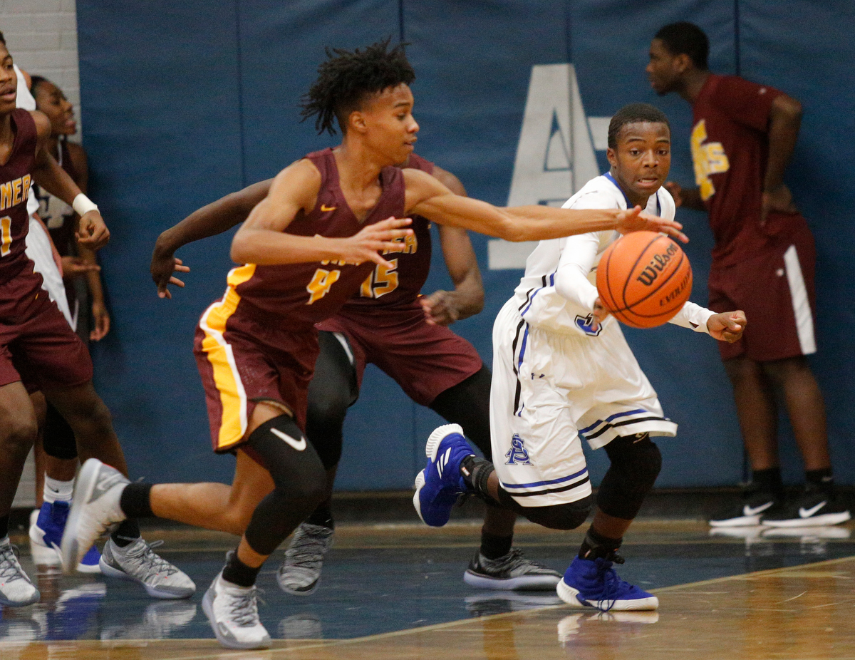 Tyner's Kameron Dozier (4) snatches the ball from CSAS's Cahlib Edwards during their prep basketball game at Chattanooga School for the Arts and Sciences on Friday, Dec. 7, 2018, in Chattanooga, Tenn.