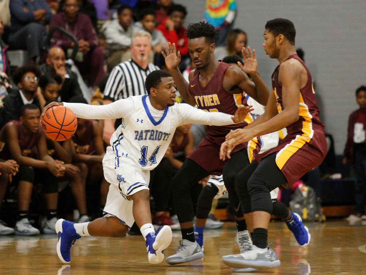 CSAS's Tony Orr, left, tries to break around Tyner's Amon Grace, center, and Kobe Smith during their prep basketball game at Chattanooga School for the Arts and Sciences on Friday, Dec. 7, 2018, in Chattanooga, Tenn.