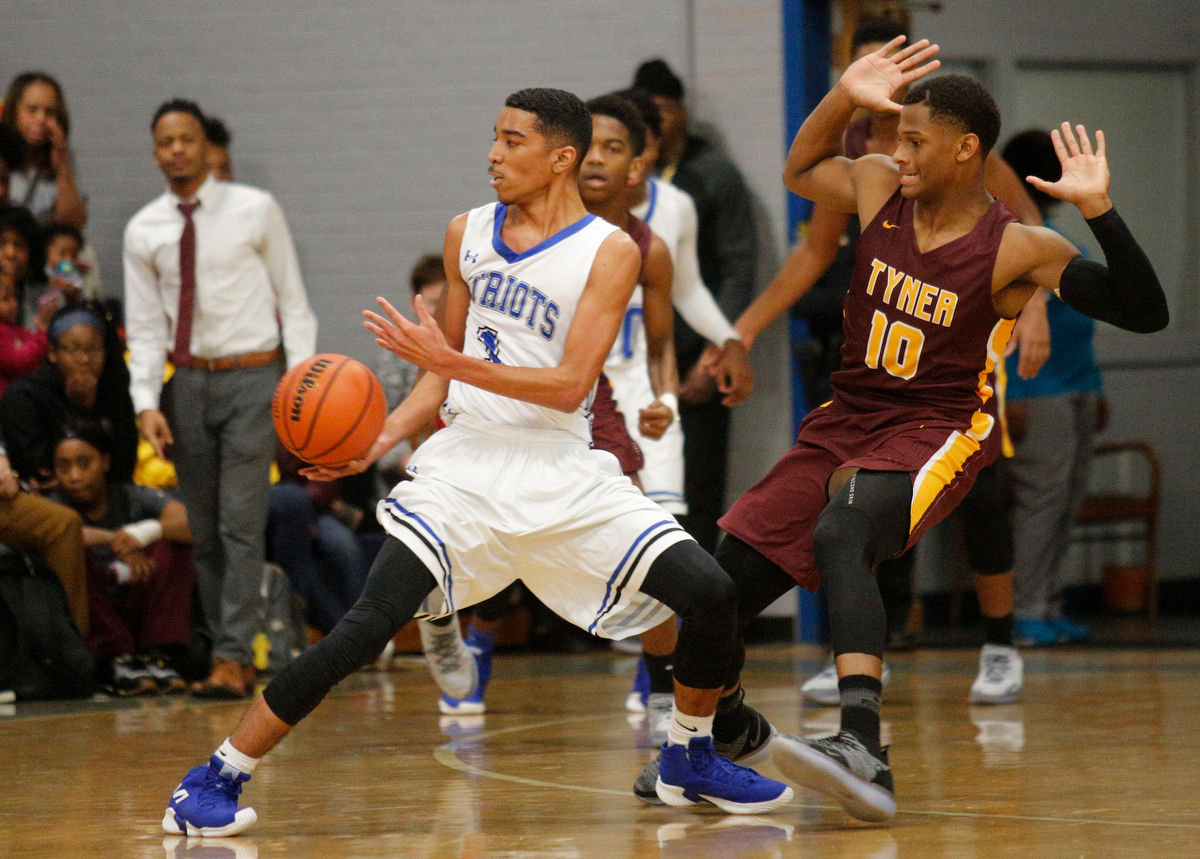 CSAS's Troy Pride passes away from Tyner's Salomon Bridgeman during their prep basketball game at Chattanooga School for the Arts and Sciences on Friday, Dec. 7, 2018, in Chattanooga, Tenn.