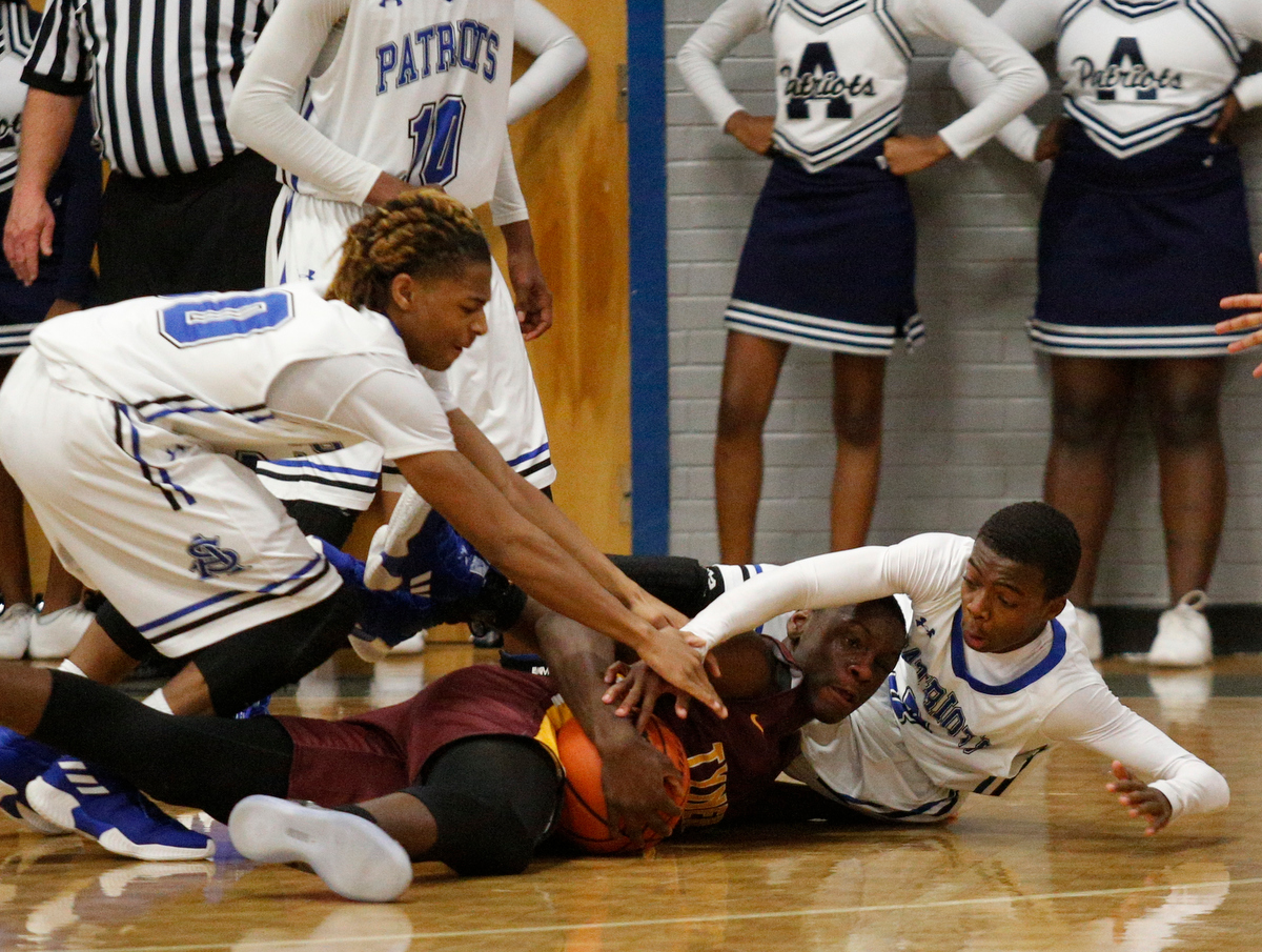 Tyner's Niegell Sturkey, center, tries to keep the ball from CSAS's Hollis Edwards, left, and Cahlib Edwards during their prep basketball game at Chattanooga School for the Arts and Sciences on Friday, Dec. 7, 2018, in Chattanooga, Tenn.