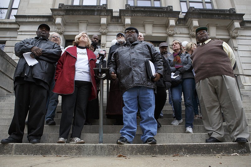 Unity Group of Chattanooga Chairman Sherman Matthews, third from right, speaks during a public statement by the Unity Group of Chattanooga about the former Harriet Tubman site on the steps of City Hall on Tuesday, Dec. 4, 2018 in Chattanooga, Tenn.