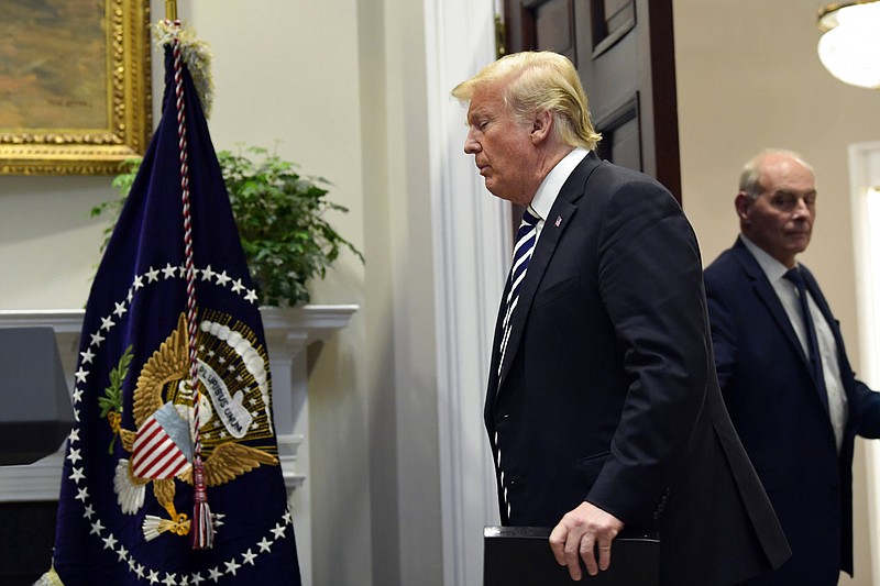 In this Nov. 1, 2018 photo, President Donald Trump walks in to the Roosevelt Room of the White House in Washington, to talk about immigration and border security. Chief of Staff John Kelly is at right. Trump says chief of staff John Kelly will leave his job at the end of the year.(AP Photo/Susan Walsh)