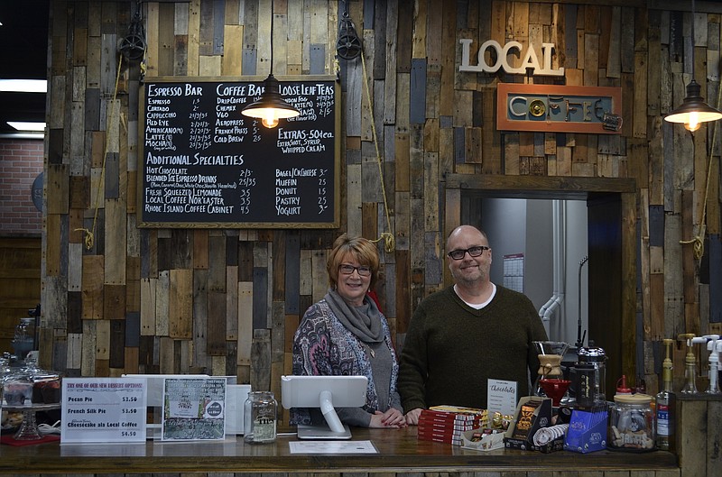 Local Coffee of East Ridge owners Debbie and Danny Lance stand behind the bar at the new shop.
