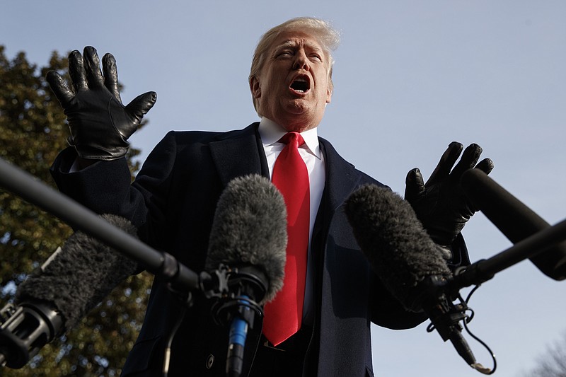 President Donald Trump talks to media before boarding Marine One on the South Lawn of the White House in Washington, Saturday, before attending the Army-Navy Football Game. (AP Photo/Carolyn Kaster)