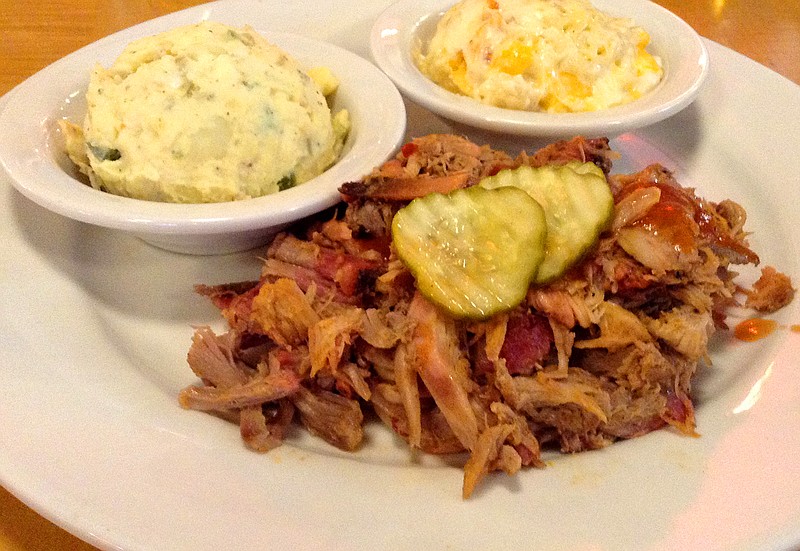 Jim 'N Nick's Bar-B-Q's classic pulled pork plate with sides of potato salad and mac and cheese. (Staff photo by Chris Zelk)