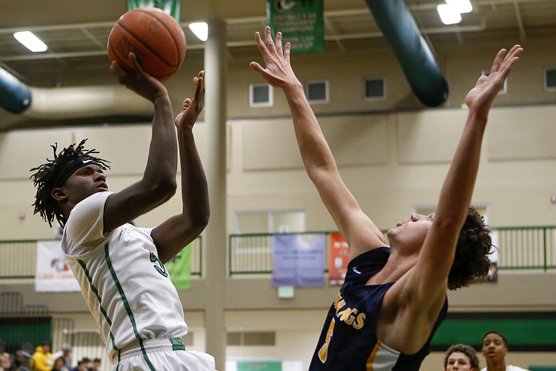 East Hamilton's Samuel Randolph (5) puts up a shot against Walker Valley's Luke Wallace (5) at East Hamilton Middle/High School on Tuesday, Dec. 11, 2018 in Chattanooga, Tenn.