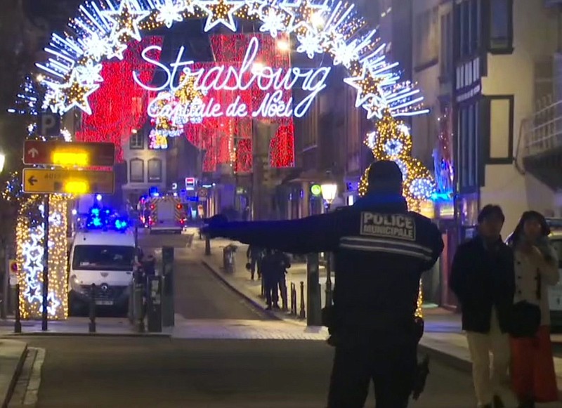 In this image made from video, emergency services arrive on the scene of a Christmas market in Strasbourg, France, Tuesday, Dec. 11, 2018. A French regional official says that a shooting in Strasbourg has left at least one dead and several wounded in the city center near a world-famous Christmas market. The prefect of France's Bas-Rhin region says the gunman, who is still at large, has been identified. Authorities haven't given a motive for the shooting. (AP Photo)