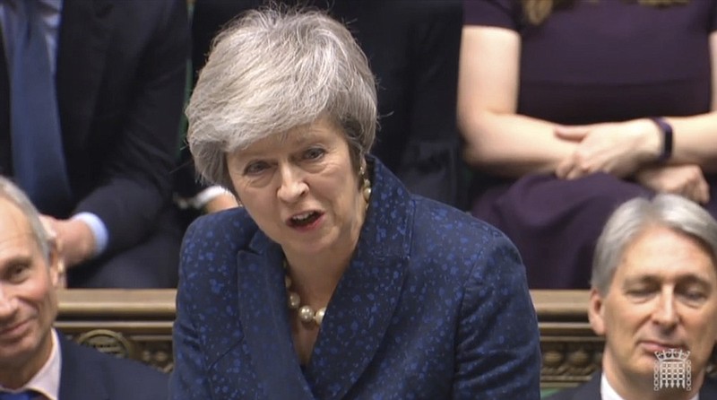 Britain's Prime Minister Theresa May speaks during the regular scheduled Prime Minister's Questions inside the House of Commons in London, Wednesday Dec. 12, 2018. May has confirmed there will be a vote of confidence in her leadership of the Conservative Party, later Wednesday with the result expected to be announced soon after. (House of Commons/PA via AP)