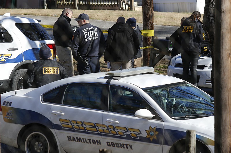 Hamilton County Sheriff's Office personnel and other officers work a scene earlier this year.