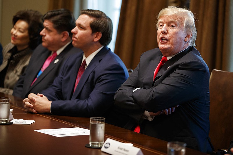 President Donald Trump speaks during a meeting with newly elected governors in the Cabinet Room of the White House, Thursday, Dec. 13, 2018, in Washington. From left, Secretary of Transportation Elaine Chao, Gov.-elect J.B. Pritzker, D-Ill., Gov.-elect Ron DeSantis, R-Fla., and Trump. (AP Photo/Evan Vucci)
